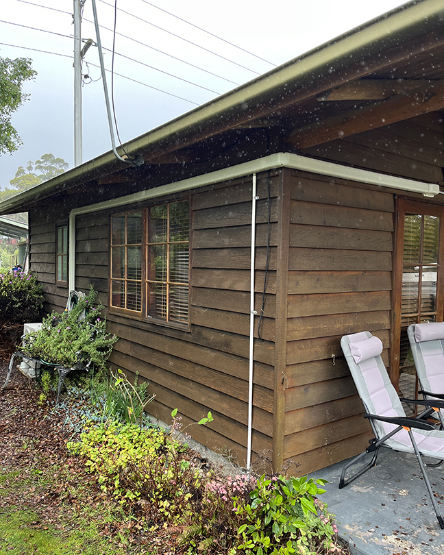 house side view with window and chair